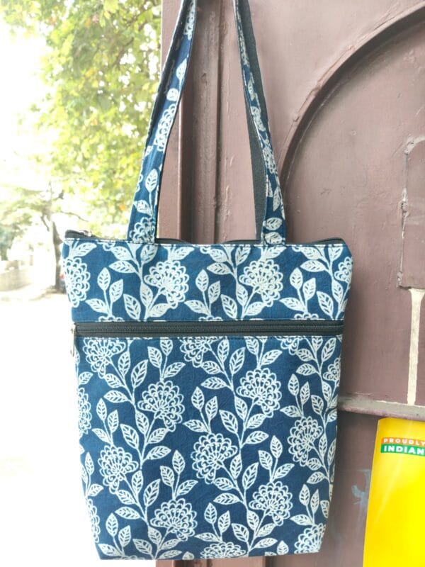 A second block-print design, indigo with a white floral motif