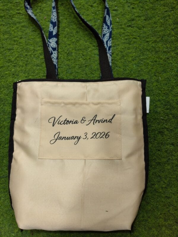 The inside of the bag: Victoria & Arvind, January 3, 2026, embroidered on the lining